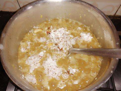 Add in fried dry fruits and grated coconut.