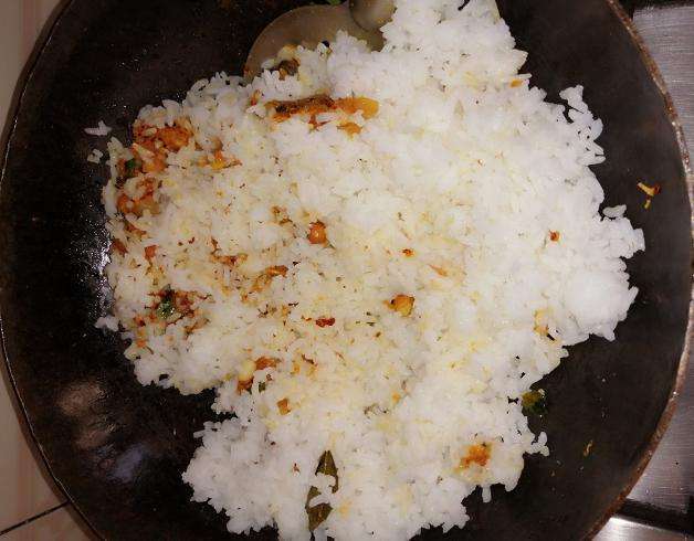 Add in cooked rice. Give a gentle mix.