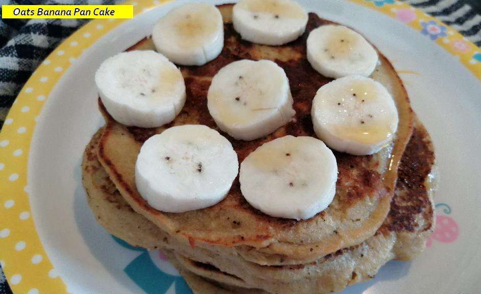 Top it with honey and serve the Oats Banana Pan Cake.