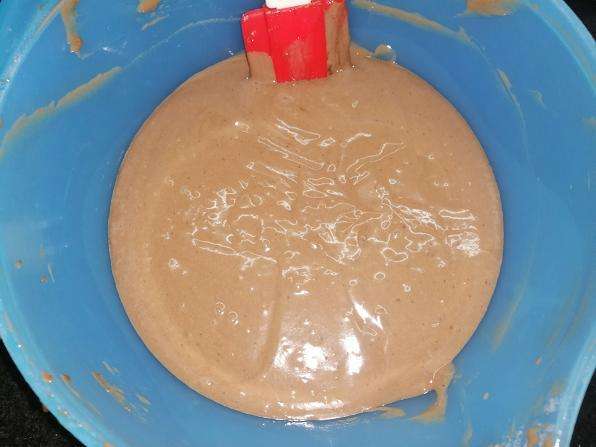 Now add in all the wet ingredients such as curd, oil, vanilla essence and give a mix. cut and fold method.