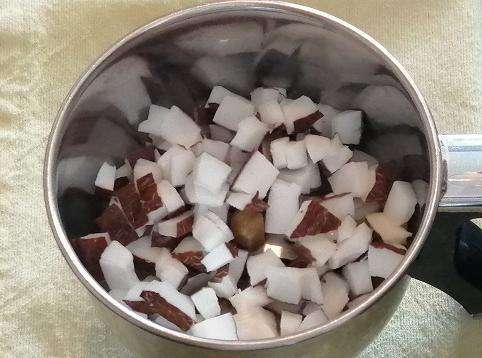 Take a jar and add in freshly chopped coconuts.