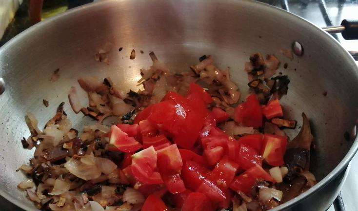 Add in chopped tomatoes.