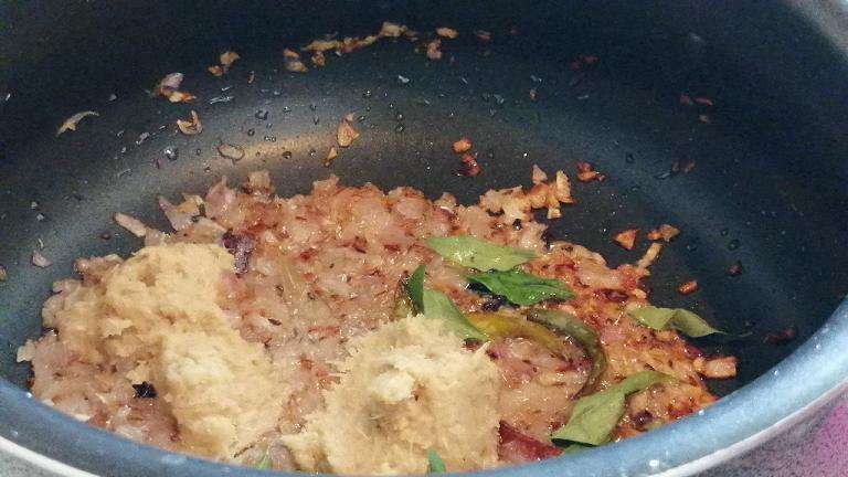 Add in ginger garlic paste and few curry leaves (optional). Fry till the raw smell goes.