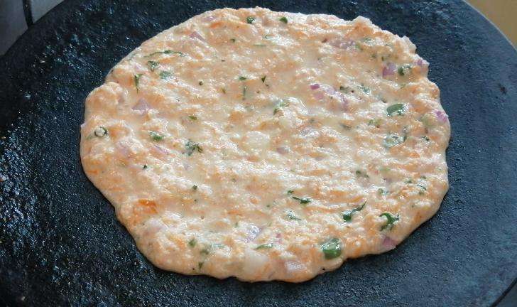 Pour the rava batter and cook both the sides.