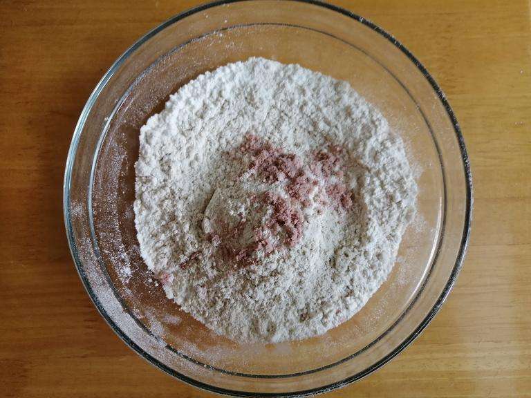 Take a mixing bowl and add in wheat flour, maida and pinch of salt and give a  mix.
