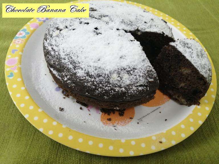 Finally sprinkle some powder sugar and serve the yummy chocolate banana wheat cake.