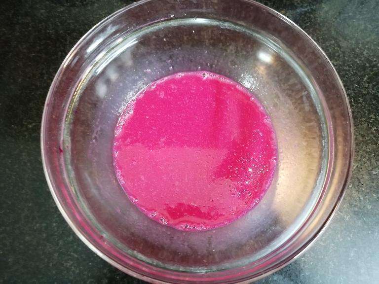 Take a bowl and add in egg, oil, vanilla essence, beetroot juice or red artificial color. Give a mix.