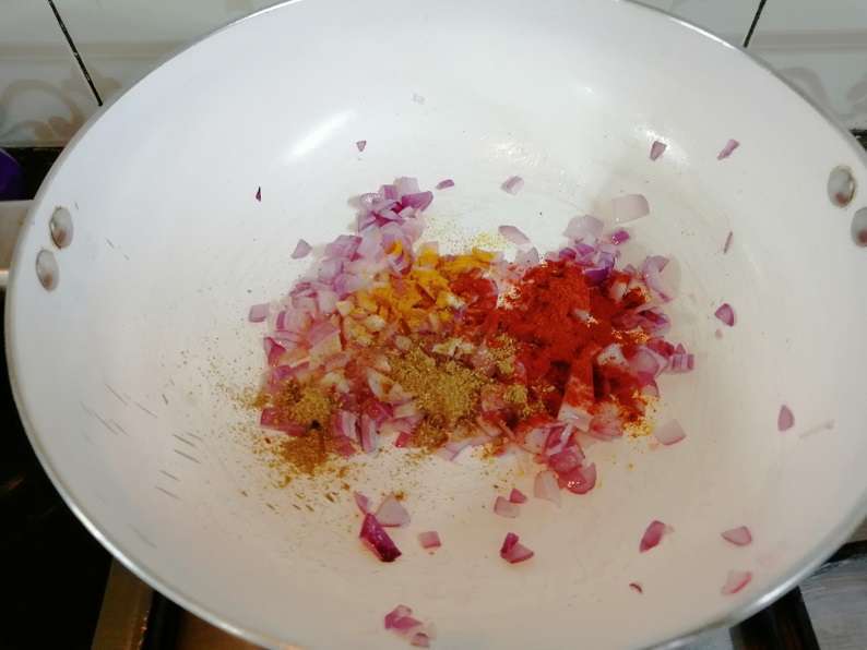 Add in chili, coriander, turmeric powder and hing. Give a mix and fry for a minute.