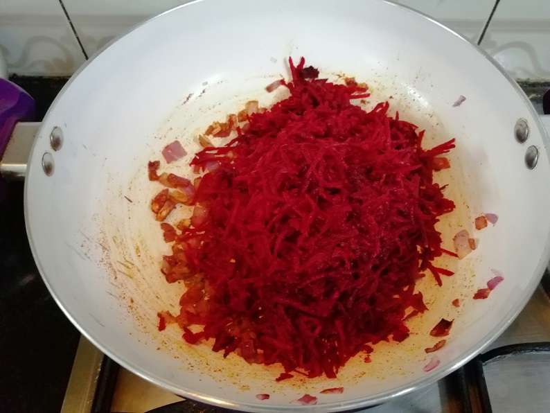 Add in grated beetroot and give a mix. Cook for 5 minutes in low flame.