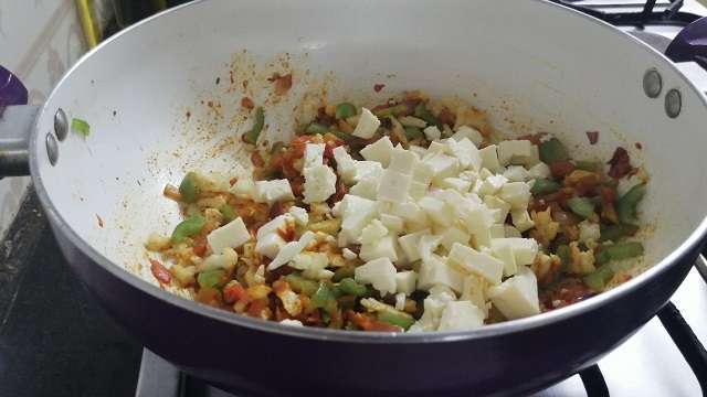 Add in paneer cubes and give a mix.