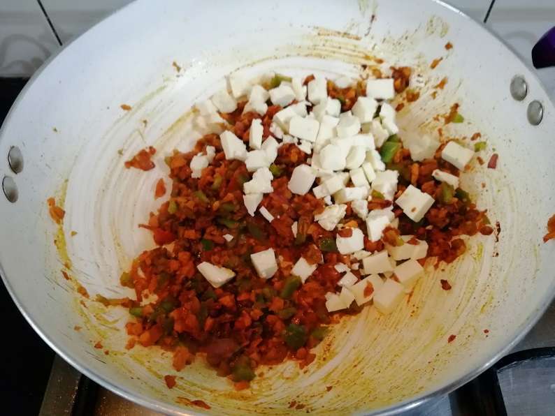 Add in chopped paneer and give a mix. Then close the lid and cook for another 3 minutes in low flame.