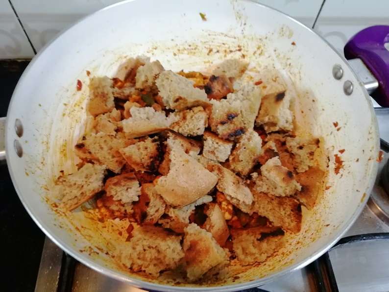 Now add in toasted breads and give a gentle mix. Close the lid and cook for 2 minutes in low flame.