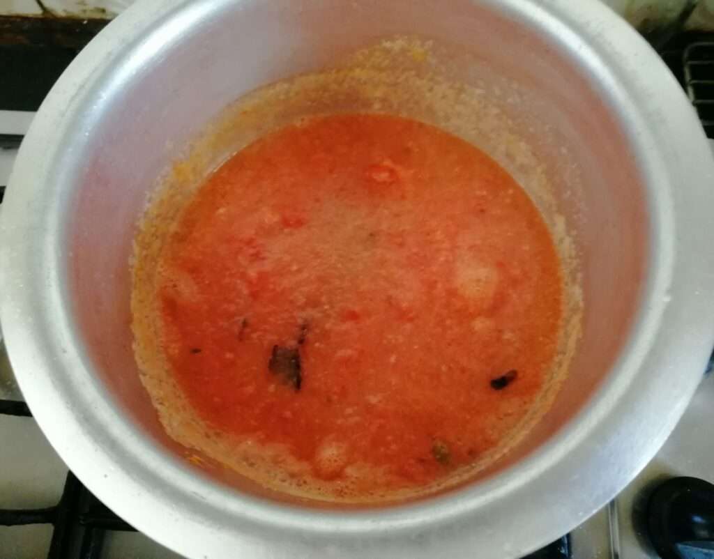 Add in tomato paste, ginger garlic paste and cook till the raw smell goes.