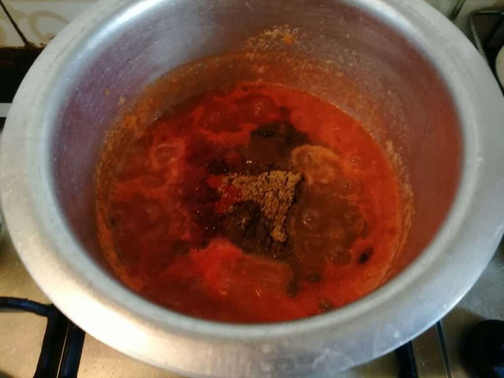 Then add in red chili powder, coriander powder, garam masala, turmeric powder and salt to taste.