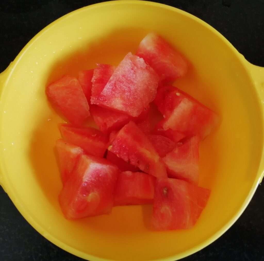 Remove the seeds and cut the water melon into pieces. Blend them in juicer or mixer jar.