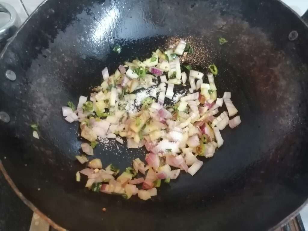 Add in chopped onions, salt as per taste.